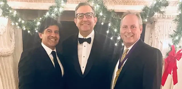 Dr. Howard Livers, Dr. Glenn Simonelli and Dr. Todd Lerner together in evening dress.